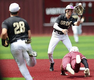 Pleasant Grove's Ty Boozer, left, throws the ball to Jarret Halter, as Liberty-Eylau's W. T. Jones slides into second base Saturday, April 27, 2024, during the District 15-4A championship game in Atlanta, Texas. The Hawks won, 10-0 (Photo by JD for the Texarkana Gazette)
